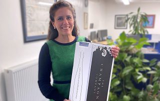 Harriet colleting the prize from AssetSphere's office in Sherborne